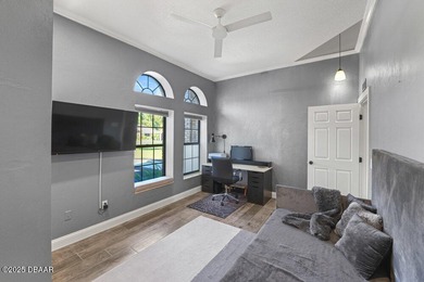 FULLY FURNISHED 5 bedroom 4 bathroom luxurious pool home sits in on Spruce Creek Golf Club in Florida - for sale on GolfHomes.com, golf home, golf lot