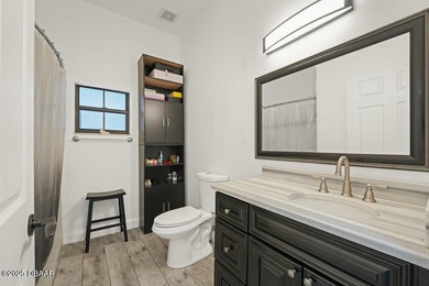 FULLY FURNISHED 5 bedroom 4 bathroom luxurious pool home sits in on Spruce Creek Golf Club in Florida - for sale on GolfHomes.com, golf home, golf lot