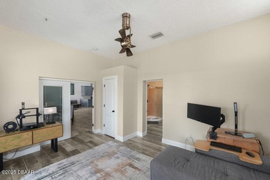 FULLY FURNISHED 5 bedroom 4 bathroom luxurious pool home sits in on Spruce Creek Golf Club in Florida - for sale on GolfHomes.com, golf home, golf lot