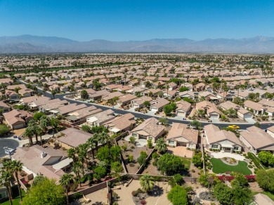Lovely extended LANAI model on beautiful park-like large lot on Mountain Vista Golf Course At Sun City Palm Desert in California - for sale on GolfHomes.com, golf home, golf lot