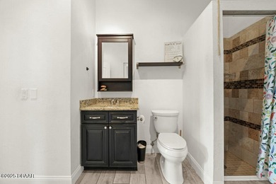 FULLY FURNISHED 5 bedroom 4 bathroom luxurious pool home sits in on Spruce Creek Golf Club in Florida - for sale on GolfHomes.com, golf home, golf lot