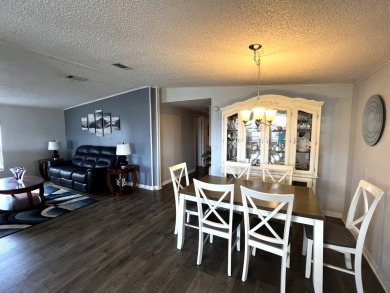This lovely 2-bedroom, 2-bathroom gem overlooks a picturesque on Lake Henry Golf Club in Florida - for sale on GolfHomes.com, golf home, golf lot