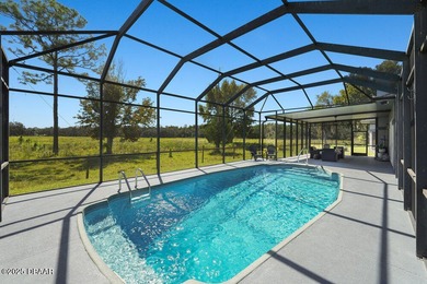 FULLY FURNISHED 5 bedroom 4 bathroom luxurious pool home sits in on Spruce Creek Golf Club in Florida - for sale on GolfHomes.com, golf home, golf lot