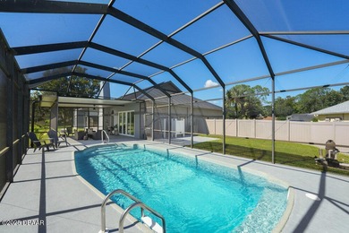 FULLY FURNISHED 5 bedroom 4 bathroom luxurious pool home sits in on Spruce Creek Golf Club in Florida - for sale on GolfHomes.com, golf home, golf lot