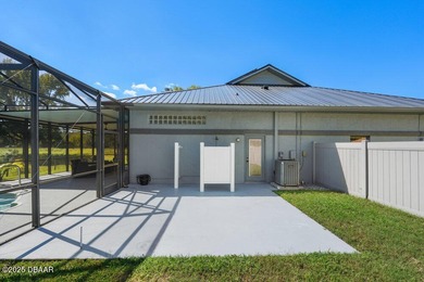 FULLY FURNISHED 5 bedroom 4 bathroom luxurious pool home sits in on Spruce Creek Golf Club in Florida - for sale on GolfHomes.com, golf home, golf lot