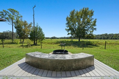 FULLY FURNISHED 5 bedroom 4 bathroom luxurious pool home sits in on Spruce Creek Golf Club in Florida - for sale on GolfHomes.com, golf home, golf lot