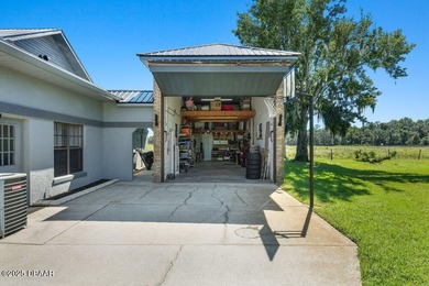 FULLY FURNISHED 5 bedroom 4 bathroom luxurious pool home sits in on Spruce Creek Golf Club in Florida - for sale on GolfHomes.com, golf home, golf lot