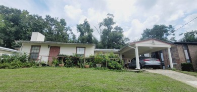 LOVELY Occupied SE Duplex w/ Carports, Fenced Yards, & Storage on Hilaman Park Golf Course in Florida - for sale on GolfHomes.com, golf home, golf lot