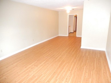 LOVELY Occupied SE Duplex w/ Carports, Fenced Yards, & Storage on Hilaman Park Golf Course in Florida - for sale on GolfHomes.com, golf home, golf lot