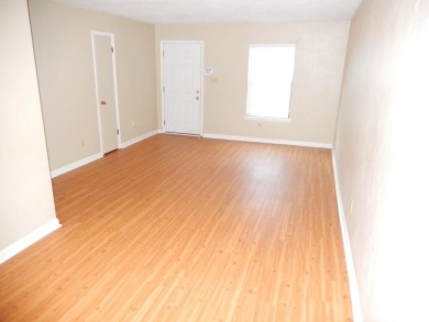 LOVELY Occupied SE Duplex w/ Carports, Fenced Yards, & Storage on Hilaman Park Golf Course in Florida - for sale on GolfHomes.com, golf home, golf lot