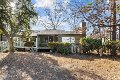 Captivating water views from almost every room in this 2-bedroom on Harbour Point Golf Club in North Carolina - for sale on GolfHomes.com, golf home, golf lot