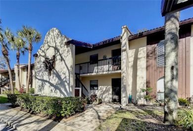 Beautiful end unit condo, located on tranquil pond with serene on Tarpon Woods Golf Club in Florida - for sale on GolfHomes.com, golf home, golf lot