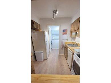Beautiful end unit condo, located on tranquil pond with serene on Tarpon Woods Golf Club in Florida - for sale on GolfHomes.com, golf home, golf lot