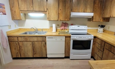Beautiful end unit condo, located on tranquil pond with serene on Tarpon Woods Golf Club in Florida - for sale on GolfHomes.com, golf home, golf lot