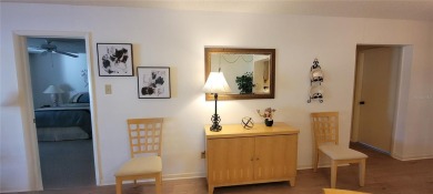 Beautiful end unit condo, located on tranquil pond with serene on Tarpon Woods Golf Club in Florida - for sale on GolfHomes.com, golf home, golf lot