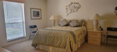 Beautiful end unit condo, located on tranquil pond with serene on Tarpon Woods Golf Club in Florida - for sale on GolfHomes.com, golf home, golf lot