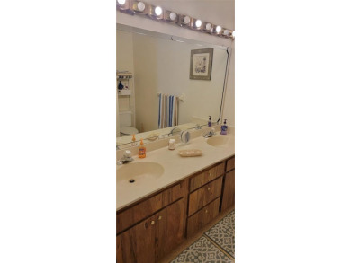 Beautiful end unit condo, located on tranquil pond with serene on Tarpon Woods Golf Club in Florida - for sale on GolfHomes.com, golf home, golf lot