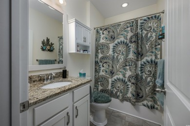 Welcome to this elegant 4-bedroom (plus 1 non-conforming) lake on Wild Wing Plantation in South Carolina - for sale on GolfHomes.com, golf home, golf lot