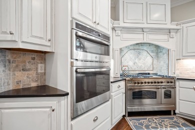 This stunning custom home overlooks the 8th fairway and green of on Reynolds Lake Oconee - The Oconee in Georgia - for sale on GolfHomes.com, golf home, golf lot