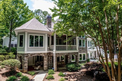 This stunning custom home overlooks the 8th fairway and green of on Reynolds Lake Oconee - The Oconee in Georgia - for sale on GolfHomes.com, golf home, golf lot