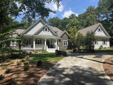 This stunning custom home overlooks the 8th fairway and green of on Reynolds Lake Oconee - The Oconee in Georgia - for sale on GolfHomes.com, golf home, golf lot