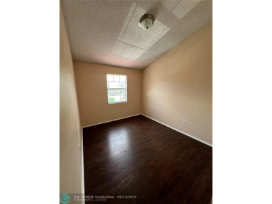 Spacious 3-Bedroom Townhome with Golf Course Views - West on Woodmont Country Club in Florida - for sale on GolfHomes.com, golf home, golf lot