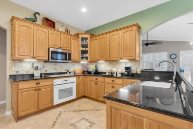 GOLF COURSE VIEWS - SPRAWLING ONE STORY - MAINTENANCE FREE - on Fox Hollow Golf Club in Florida - for sale on GolfHomes.com, golf home, golf lot