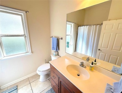 This beautiful Tommy Waters home is ideally located walking on Haile Plantation Golf and Country Club in Florida - for sale on GolfHomes.com, golf home, golf lot