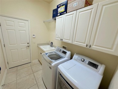 This beautiful Tommy Waters home is ideally located walking on Haile Plantation Golf and Country Club in Florida - for sale on GolfHomes.com, golf home, golf lot