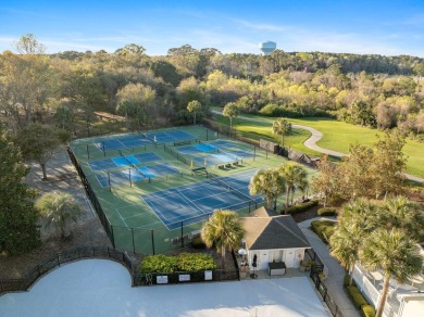 Mature live oaks and lush landscaping frame the elegant front on Kiawah Island Resort - Oak Point in South Carolina - for sale on GolfHomes.com, golf home, golf lot