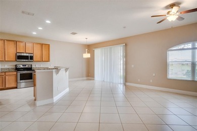 This Eagle Creek townhouse with an upstairs balcony overlooking on Eagle Creek Golf Club in Florida - for sale on GolfHomes.com, golf home, golf lot