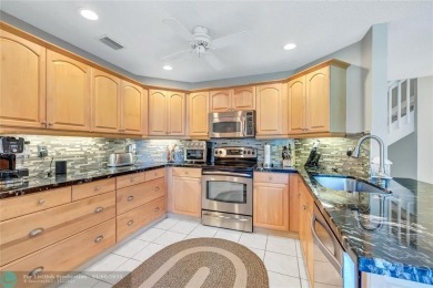 Enjoy a $9,000 credit and home warranty with this stunning home! on The Carolina Club in Florida - for sale on GolfHomes.com, golf home, golf lot