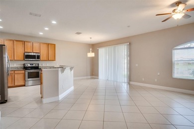 This Eagle Creek townhouse with an upstairs balcony overlooking on Eagle Creek Golf Club in Florida - for sale on GolfHomes.com, golf home, golf lot