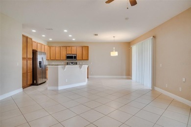 This Eagle Creek townhouse with an upstairs balcony overlooking on Eagle Creek Golf Club in Florida - for sale on GolfHomes.com, golf home, golf lot