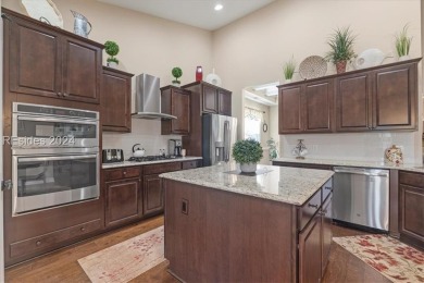 Former Model Home, situated on the 9th hole of the prestigious on Hilton Head Lakes Golf Club in South Carolina - for sale on GolfHomes.com, golf home, golf lot