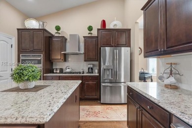 Former Model Home, situated on the 9th hole of the prestigious on Hilton Head Lakes Golf Club in South Carolina - for sale on GolfHomes.com, golf home, golf lot