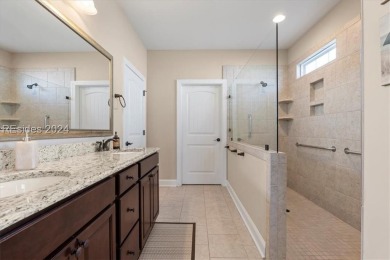 Former Model Home, situated on the 9th hole of the prestigious on Hilton Head Lakes Golf Club in South Carolina - for sale on GolfHomes.com, golf home, golf lot