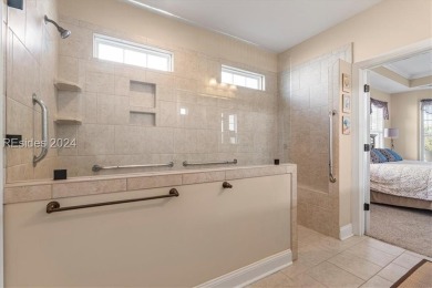 Former Model Home, situated on the 9th hole of the prestigious on Hilton Head Lakes Golf Club in South Carolina - for sale on GolfHomes.com, golf home, golf lot