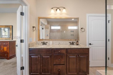 Former Model Home, situated on the 9th hole of the prestigious on Hilton Head Lakes Golf Club in South Carolina - for sale on GolfHomes.com, golf home, golf lot