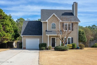 This home is instantly appealing and very well maintained. It on Beau Rivage Golf and Resort in North Carolina - for sale on GolfHomes.com, golf home, golf lot