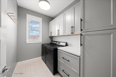This stunning 2019-built home offers 4 spacious bedrooms PLUS a on Duran Golf Course in Florida - for sale on GolfHomes.com, golf home, golf lot