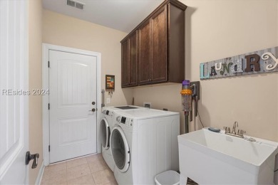 Former Model Home, situated on the 9th hole of the prestigious on Hilton Head Lakes Golf Club in South Carolina - for sale on GolfHomes.com, golf home, golf lot