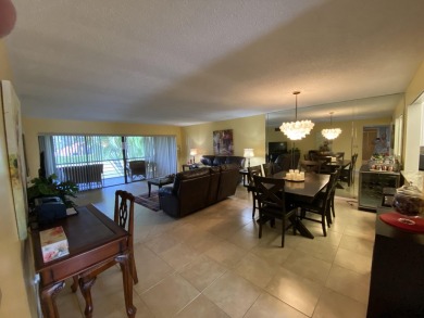 Beautiful unit with relaxing view from screen porch ready for on Indian Spring Golf and Country Club in Florida - for sale on GolfHomes.com, golf home, golf lot