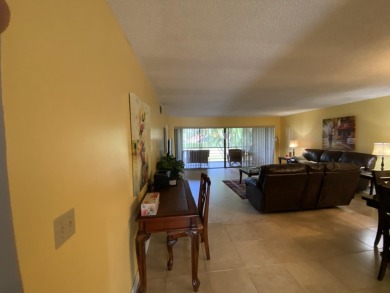 Beautiful unit with relaxing view from screen porch ready for on Indian Spring Golf and Country Club in Florida - for sale on GolfHomes.com, golf home, golf lot