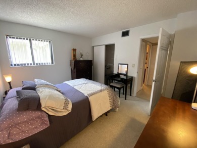 Beautiful unit with relaxing view from screen porch ready for on Indian Spring Golf and Country Club in Florida - for sale on GolfHomes.com, golf home, golf lot