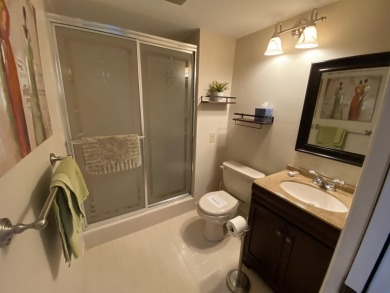 Beautiful unit with relaxing view from screen porch ready for on Indian Spring Golf and Country Club in Florida - for sale on GolfHomes.com, golf home, golf lot