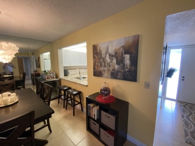 Beautiful unit with relaxing view from screen porch ready for on Indian Spring Golf and Country Club in Florida - for sale on GolfHomes.com, golf home, golf lot