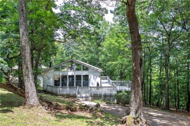 Tucked into the natural beauty of Bent Tree, this charming on Bent Tree Golf Course in Georgia - for sale on GolfHomes.com, golf home, golf lot