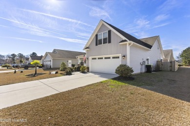 Charming 4-Bedroom Home with Solar Power on a Corner Lot in on Magnolia Greens Golf Plantation in North Carolina - for sale on GolfHomes.com, golf home, golf lot