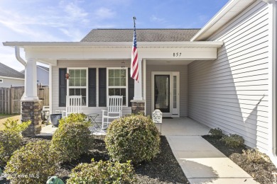 Charming 4-Bedroom Home with Solar Power on a Corner Lot in on Magnolia Greens Golf Plantation in North Carolina - for sale on GolfHomes.com, golf home, golf lot